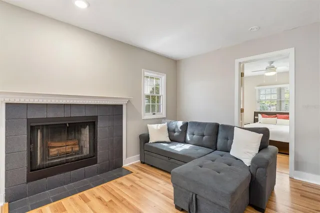 a living room with furniture and a fireplace
