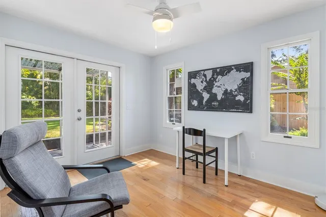 a view of a livingroom with furniture and a window