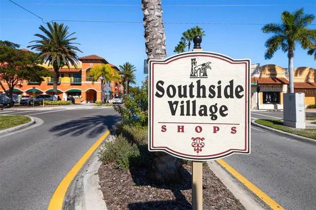 a front view of multi story residential apartment building with yard