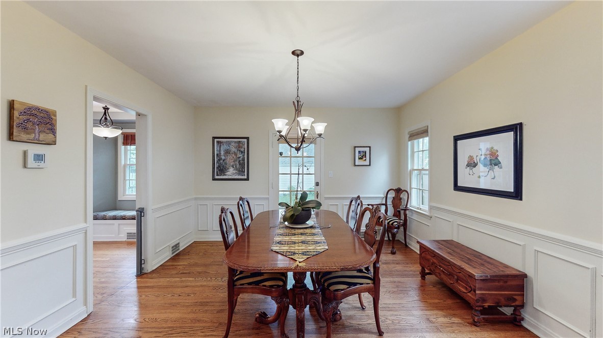 3658 Traver Road Shaker Heights, OH 44122 - Photo 6 of 33 Dining area featuring a wealth of natural light, wood-type flooring, and a chandelier