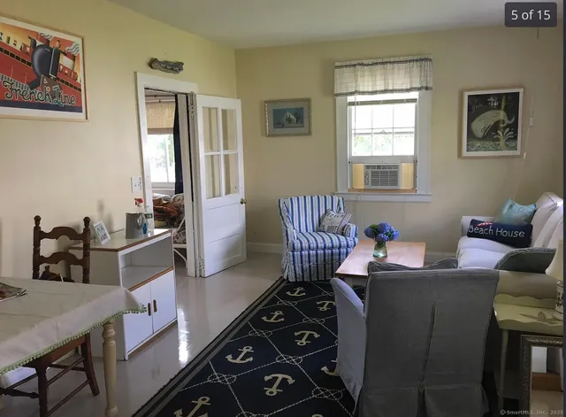 a living room with furniture and a window