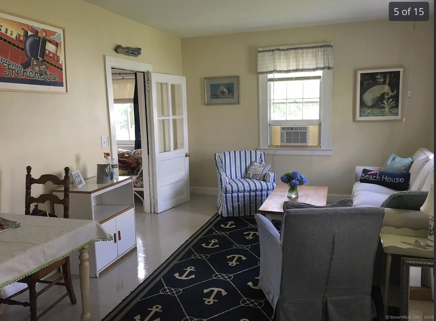 621 Fairfield Beach Road Fairfield, CT 06824 - Photo 2 of 7 a living room with furniture and a window