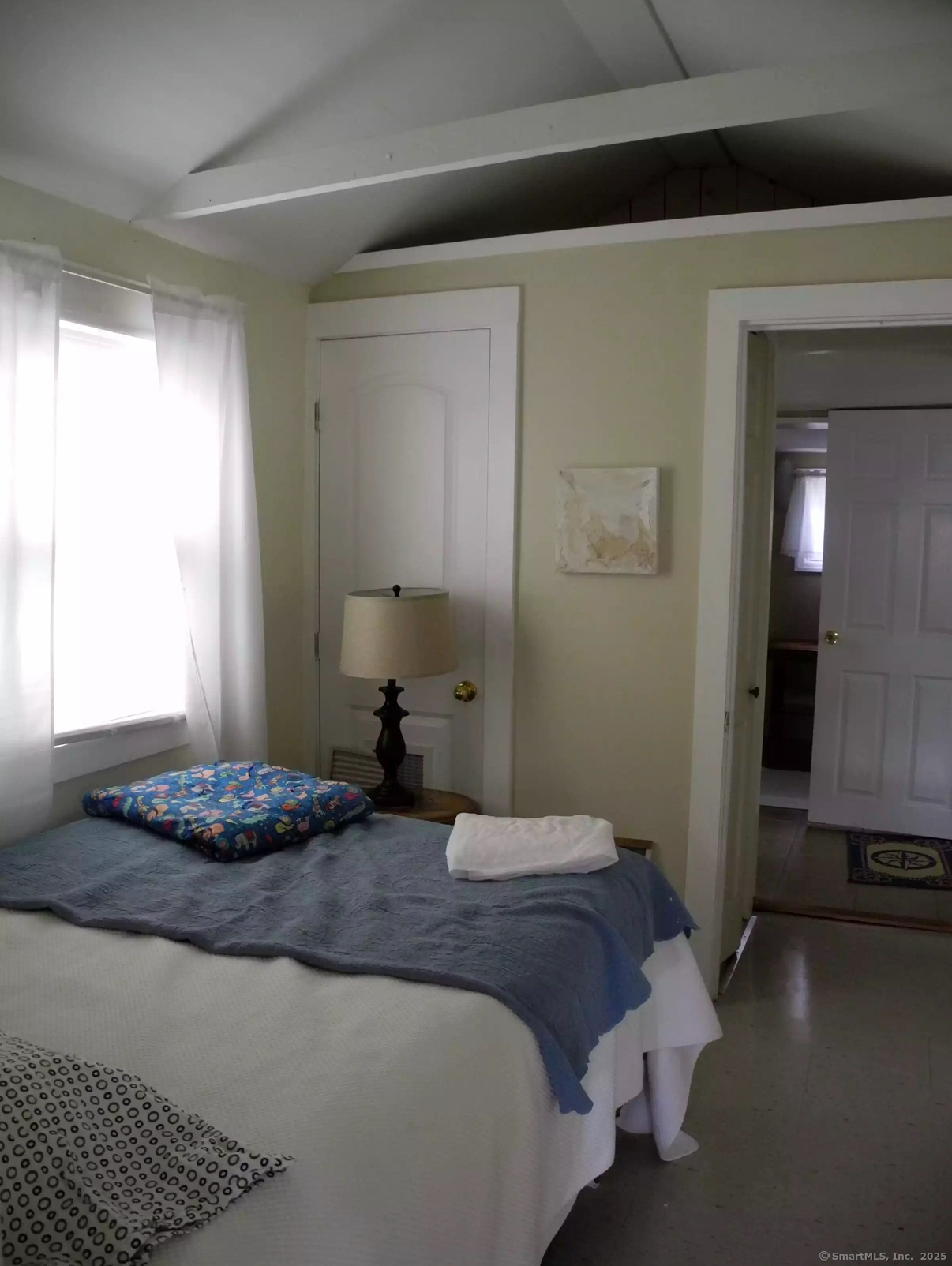 621 Fairfield Beach Road Fairfield, CT 06824 - Photo 4 of 7 a bedroom with a bed and a window