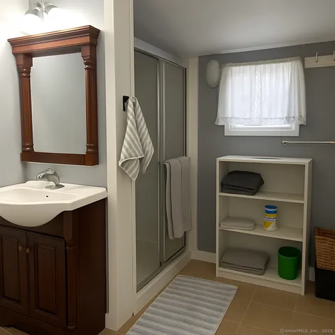 a bathroom with a sink a vanity and a mirror