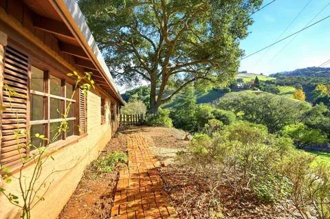 a view of a backyard of the house