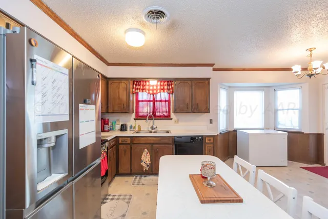 a view of a dining room with furniture and window