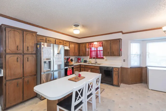 a view of a workspace with furniture