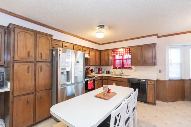 a living room with furniture a rug and a closet