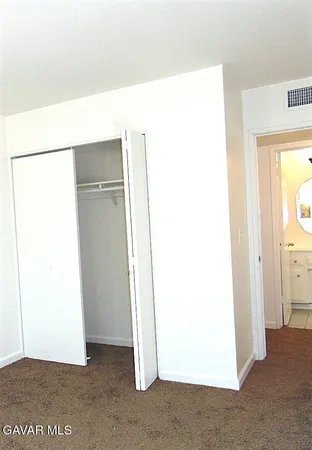a white toilet sitting next to a bath tub
