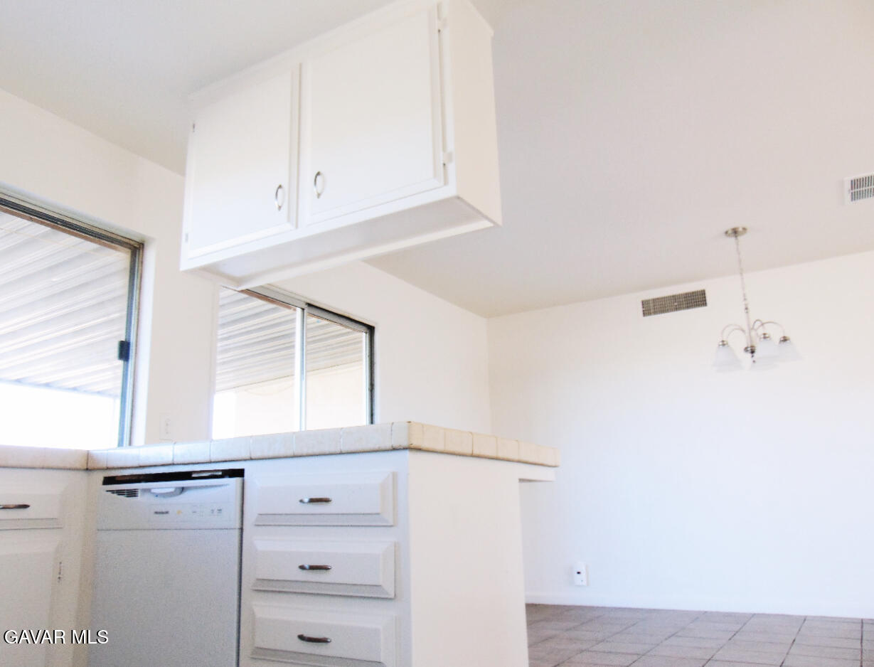 1260 North El Prado Street Ridgecrest, CA 93555 - Photo 4 of 28 a view of a closet area with hardwood floor