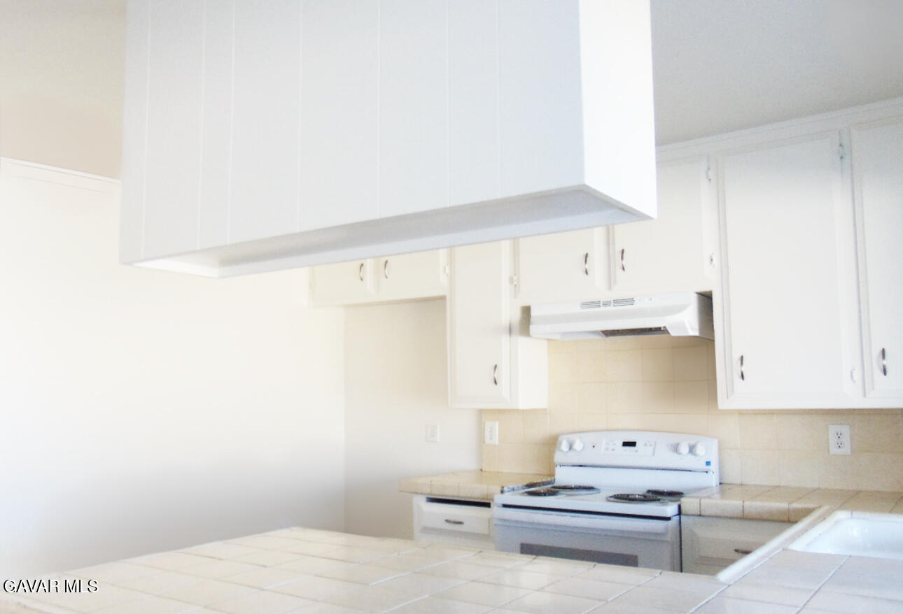 1260 North El Prado Street Ridgecrest, CA 93555 - Photo 5 of 28 a living room with furniture and a kitchen