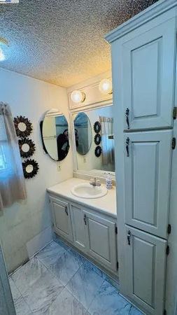 a bathroom with a sink and mirror