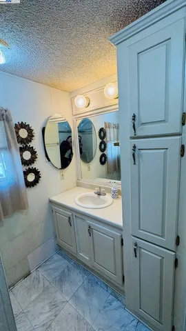 a bathroom with a sink and mirror
