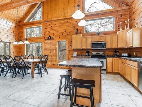 a view of a patio with a table and chairs