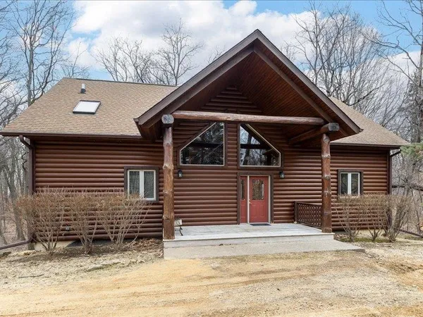 a balcony with wooden floor and fence
