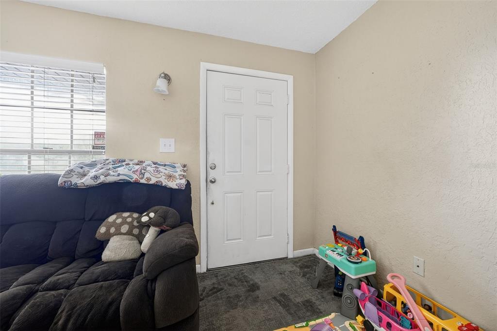 1644 Ruth Street Cocoa, FL 32926 - Photo 7 of 38 a bed room with a bed and a window