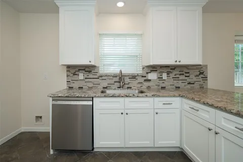 a view of a livingroom with a ceiling fan and window