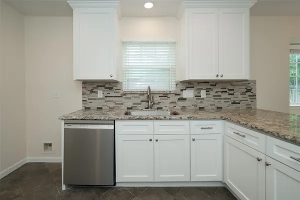 a view of a livingroom with a ceiling fan and window