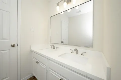 a view of a hallway with stairs