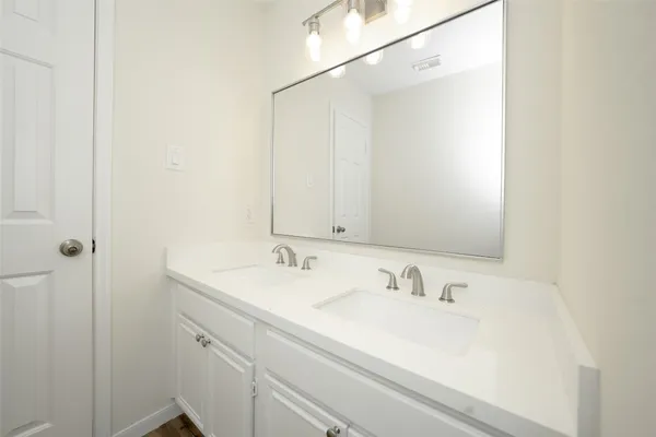 a view of a hallway with stairs