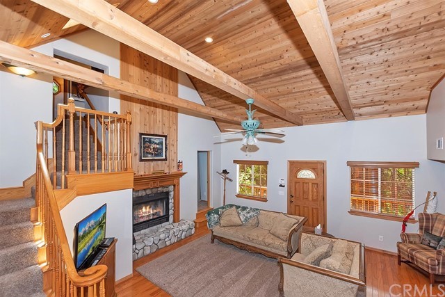 659 Blue Jay Canyon Road Blue Jay, CA 92317 - Photo 14 of 40 a living room with furniture and a fireplace