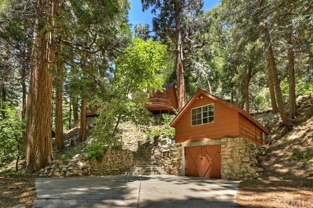 659 Blue Jay Canyon Road Blue Jay, CA 92317 - Photo 2 of 40 a front view of a house with trees