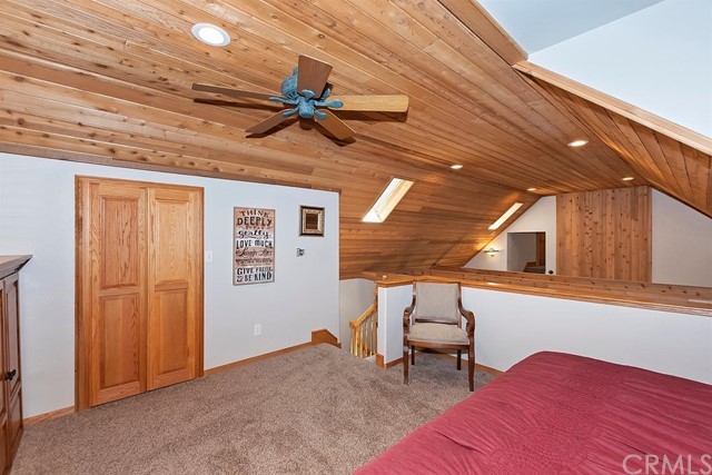 659 Blue Jay Canyon Road Blue Jay, CA 92317 - Photo 23 of 40 a bedroom with furniture and a window