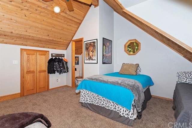 659 Blue Jay Canyon Road Blue Jay, CA 92317 - Photo 24 of 40 a bedroom with a bed and a wall painting