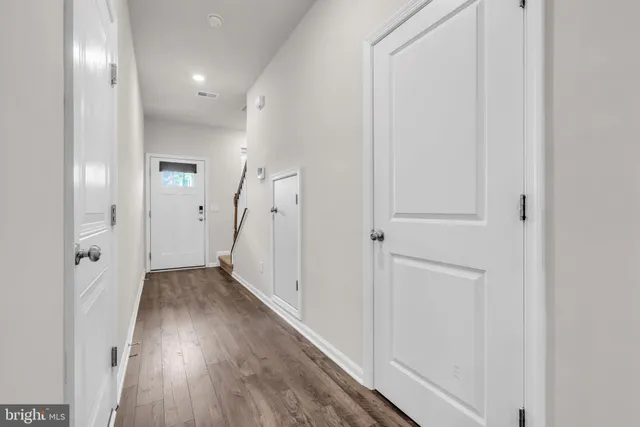 a bathroom with a sink a mirror and a toilet