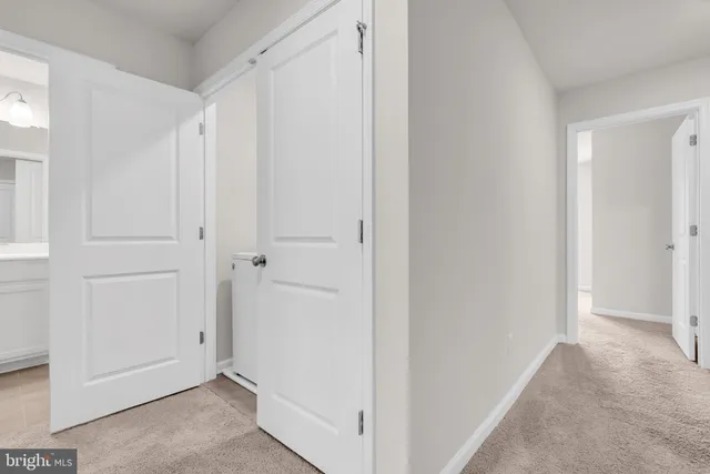 a utility room with closet dryer and washer
