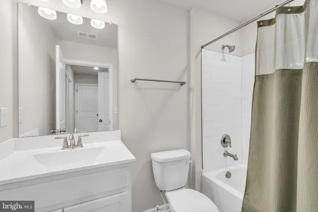 a brick house that is sitting in the grass