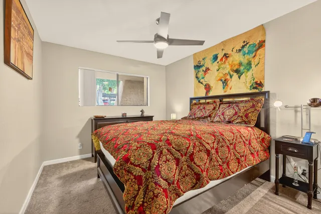 a bedroom with a bed and window