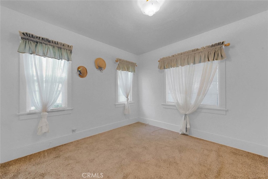 220 East Duarte Road Arcadia, CA 91006 - Photo 5 of 10 an empty room with windows and closet