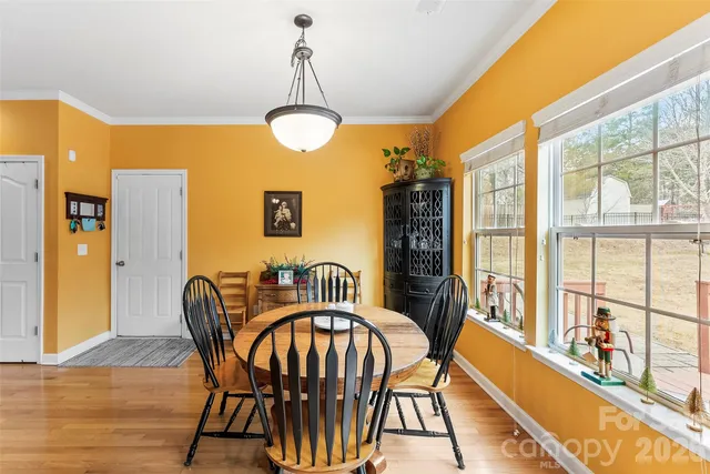 a dining room with furniture a livingroom and chandelier