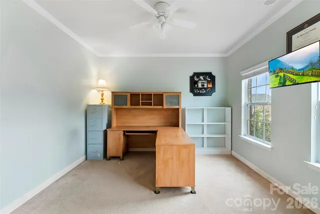 a bathroom with a sink mirror and a toilet
