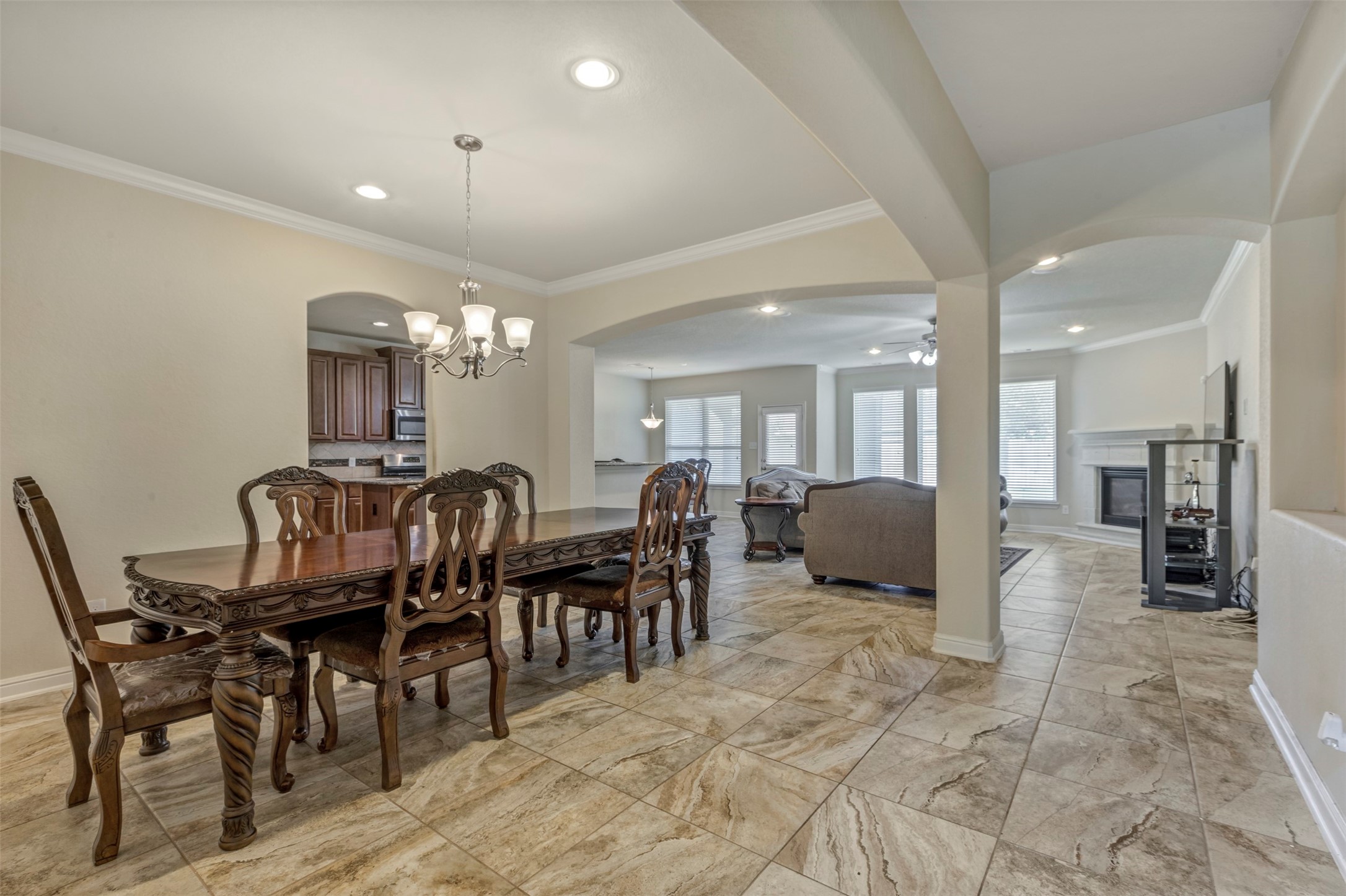 24515 Flora Meadow Drive Spring, TX 77373 - Photo 7 of 34 This listing features a spacious layout, an elegant dining area, and luxurious flooring.