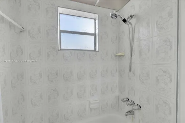 a view of a patio with couches and table and chairs