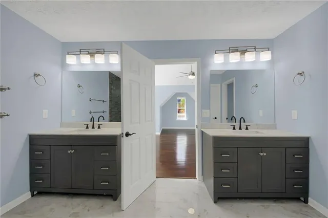 a spacious bathroom with a double vanity sink double and mirror