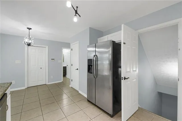 a bathroom with a shower and a glass door