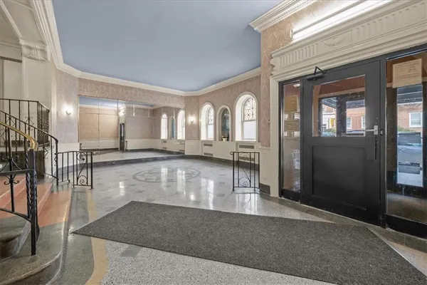 a view of a living room and entryway