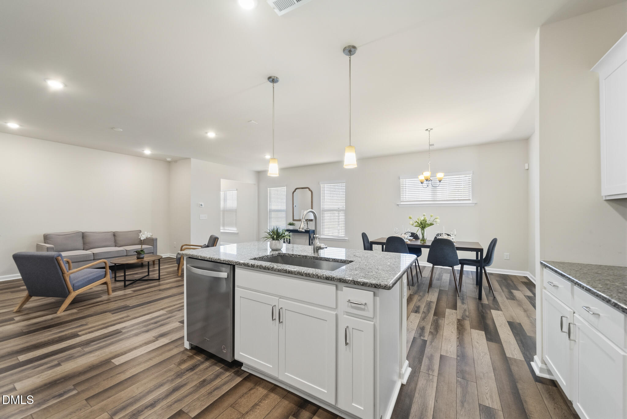 1012 Citadel Avenue Durham, NC 27713 - Photo 13 of 34 a kitchen with a sink and chairs