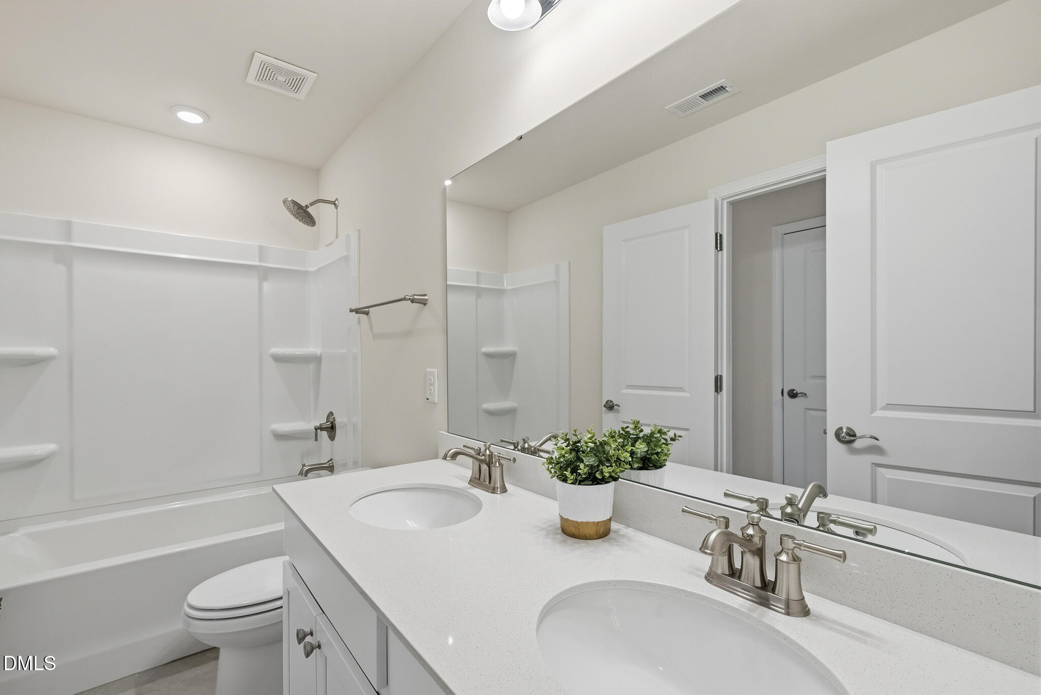 1012 Citadel Avenue Durham, NC 27713 - Photo 26 of 34 a bathroom with a granite countertop sink a toilet and shower