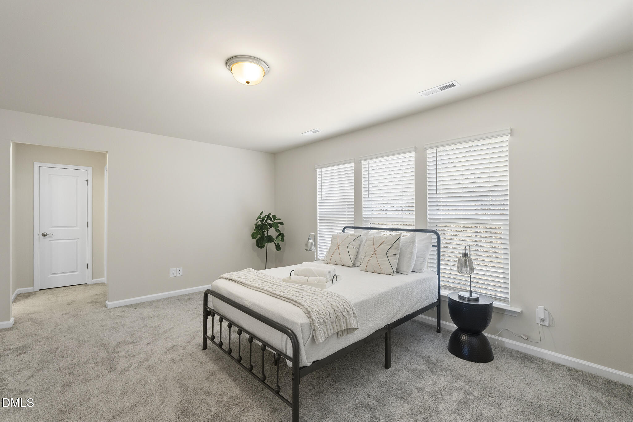 1012 Citadel Avenue Durham, NC 27713 - Photo 29 of 34 a bedroom with a bed and a table