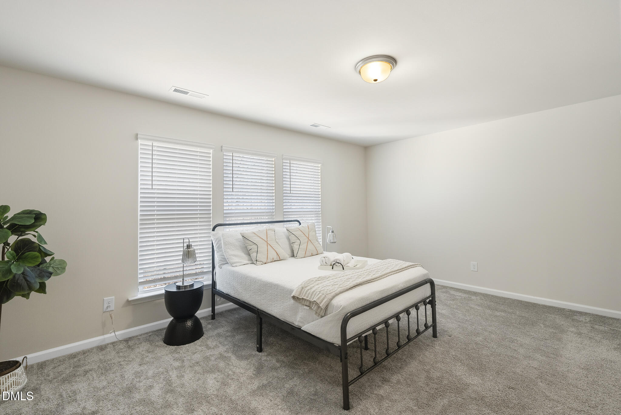 1012 Citadel Avenue Durham, NC 27713 - Photo 30 of 34 a white bed sitting in a bedroom next to a window