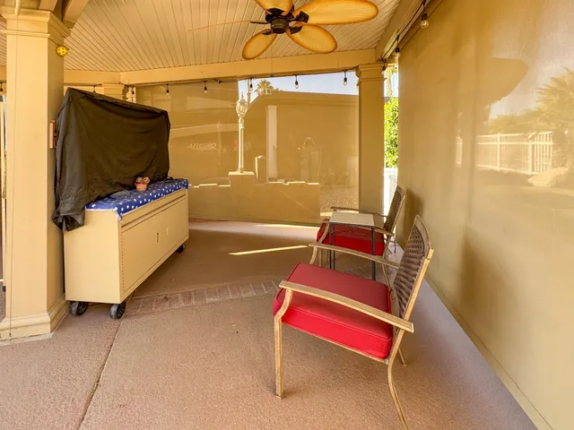 a living room with a flat screen tv and a couch