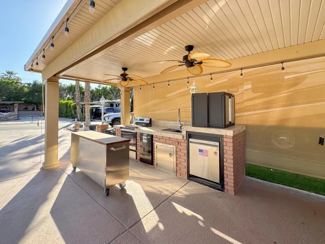 a view of a kitchen with a sink and washing machine