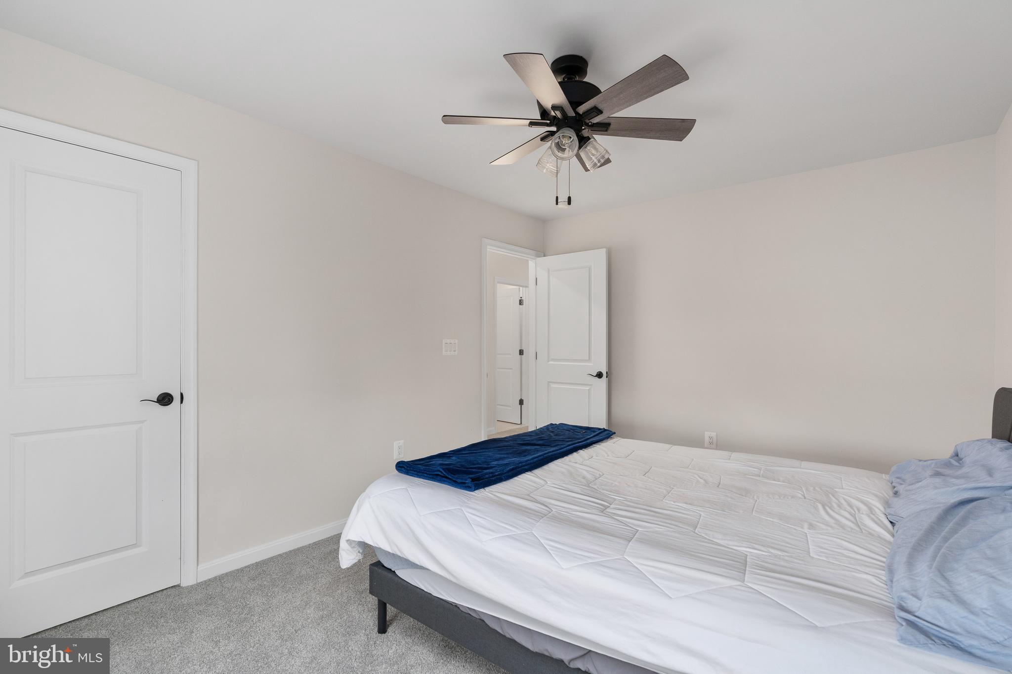 35514 Aspen Way Locust Grove, VA 22508 - Photo 25 of 56 a bedroom with a bed and a chandelier