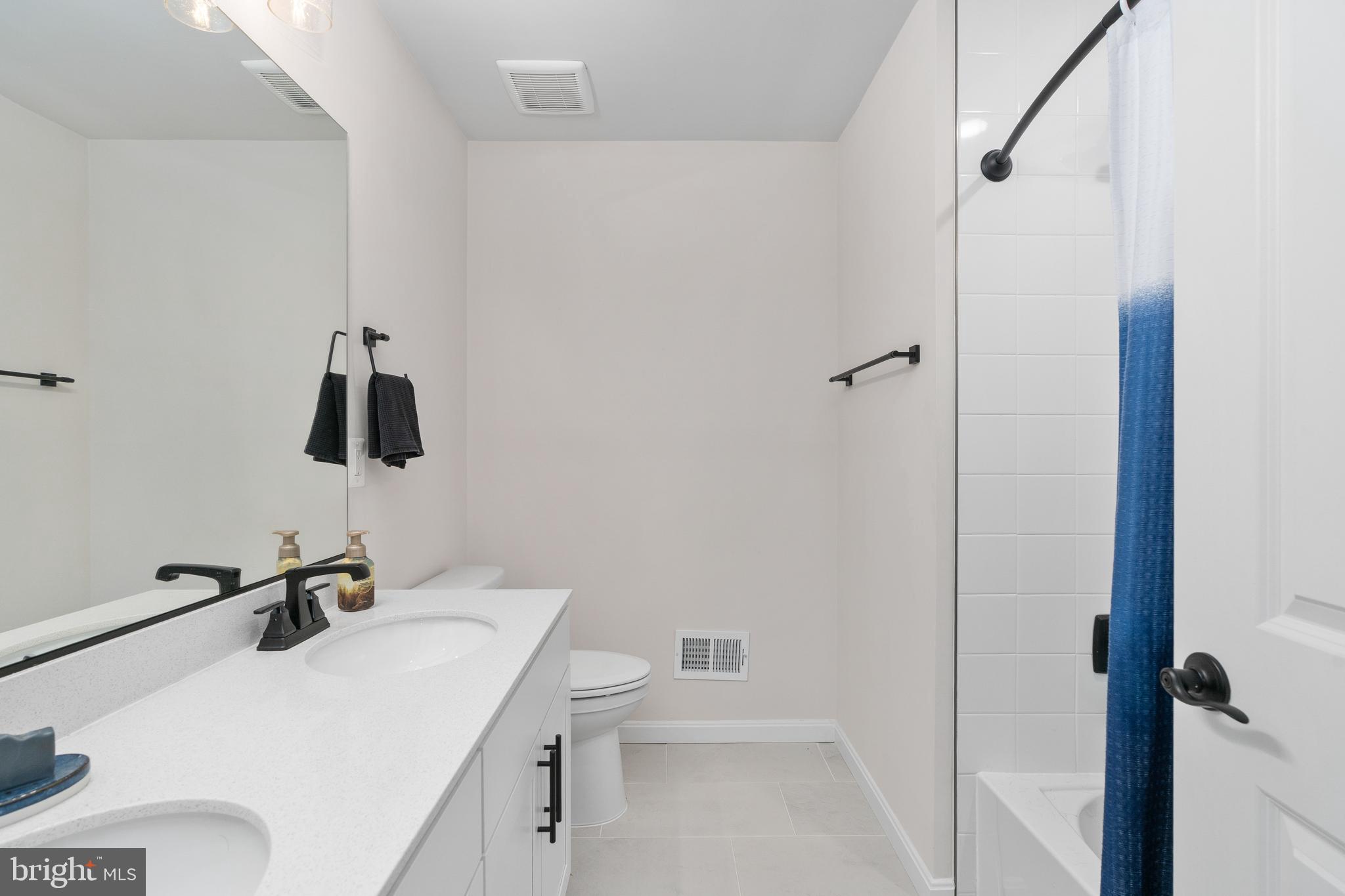 35514 Aspen Way Locust Grove, VA 22508 - Photo 30 of 56 a bathroom with a sink toilet and a mirror