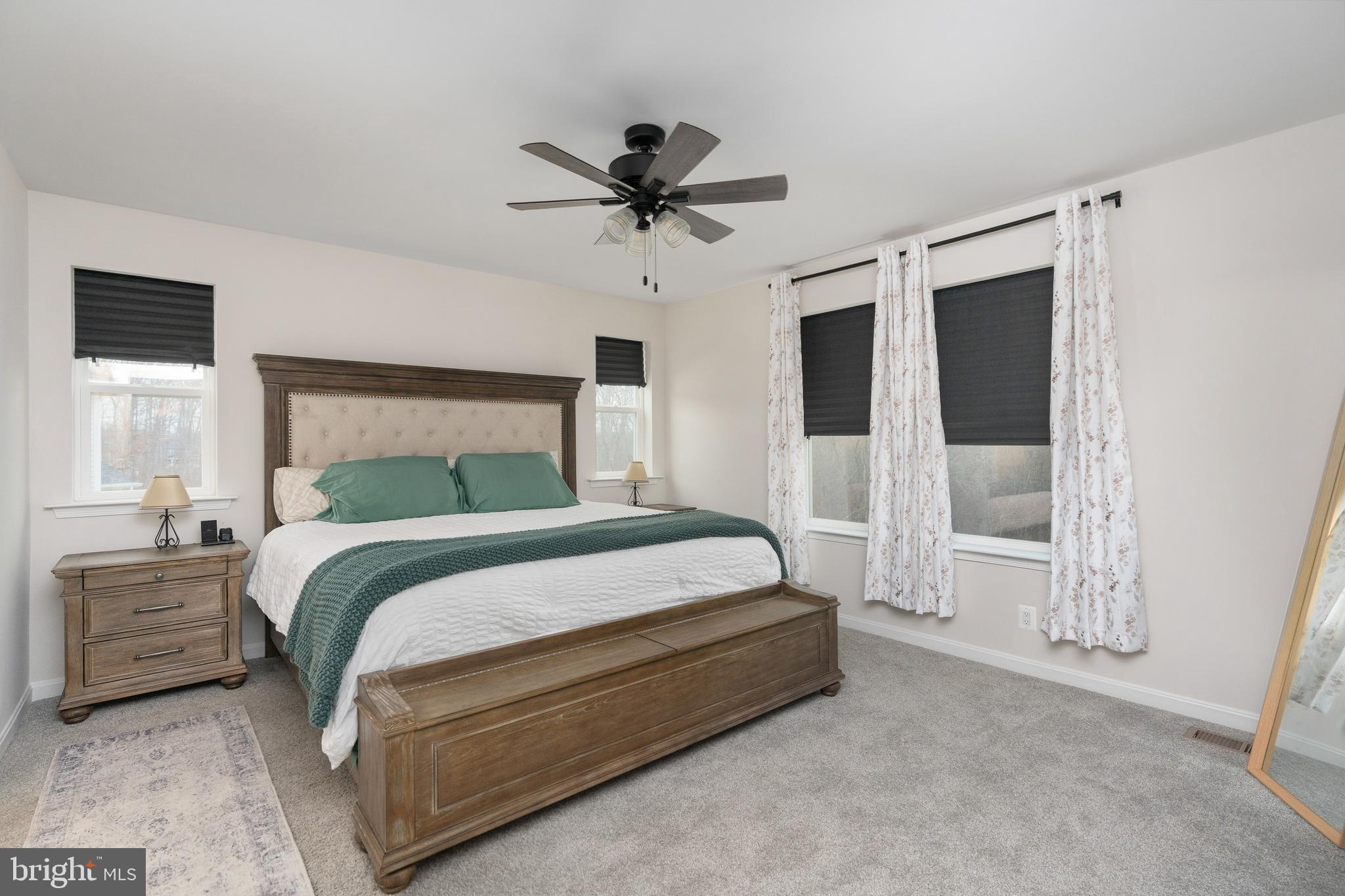 35514 Aspen Way Locust Grove, VA 22508 - Photo 38 of 56 a bedroom with a bed and a chandelier