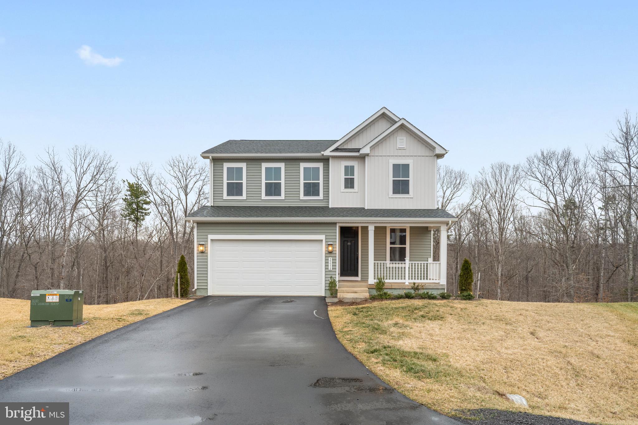 35514 Aspen Way Locust Grove, VA 22508 - Photo 46 of 56 a front view of a house with a yard and garage